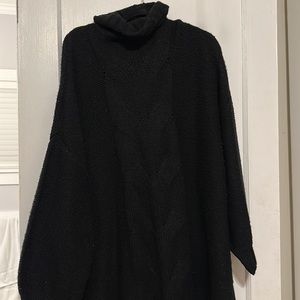 Black tunic length turtleneck sweater